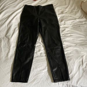 Black leather pants with slits on the bottom